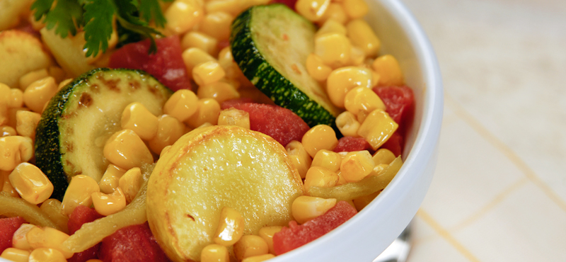 Summer squash pair with tomatoes and corn in this easy, flavorful side dish.
