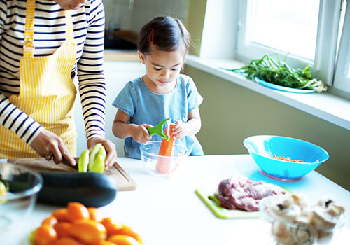 Older kids can use a vegetable peeler to peel carrots or potatoes.